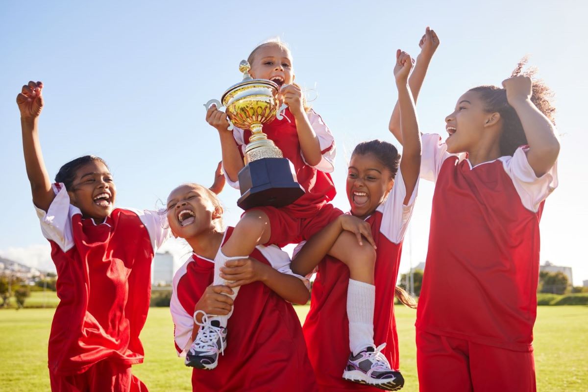 soccer-team-and-trophy-with-children-in-celebrati-2023-11-27-04-52-29-utc